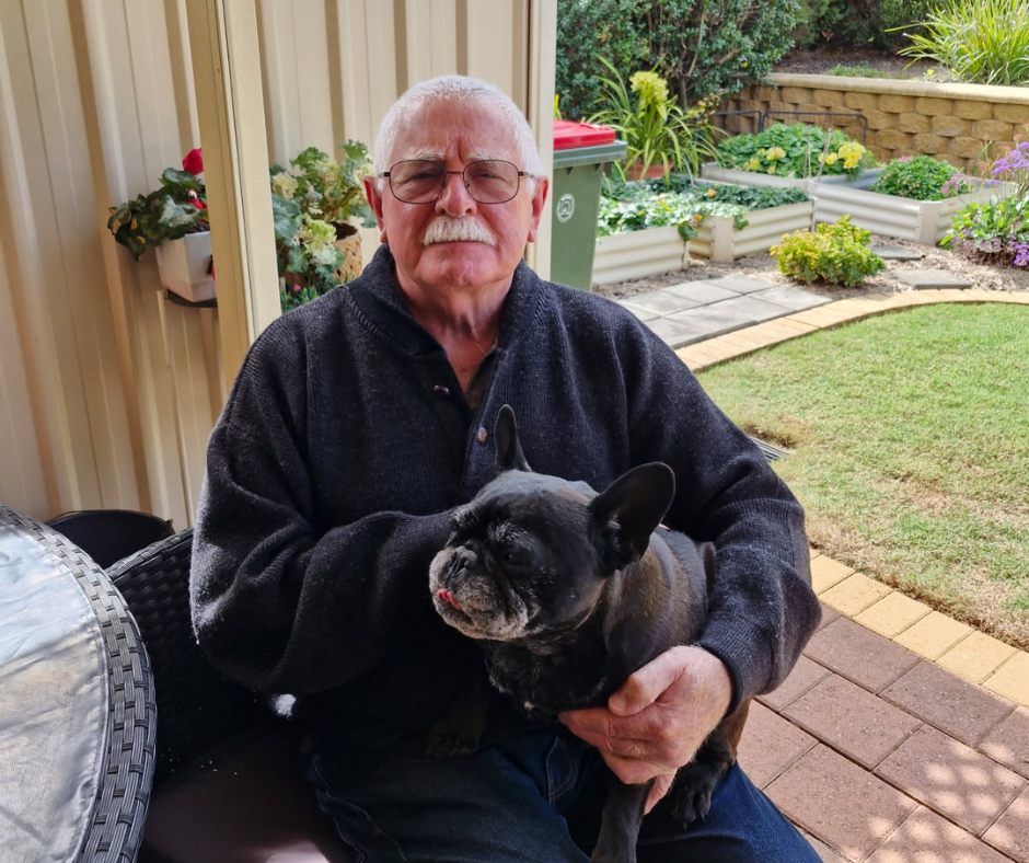 Man holding his dog.