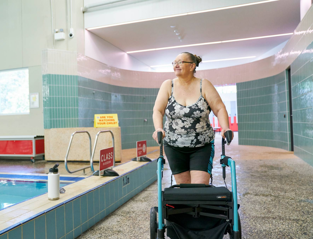 woman walking near pool