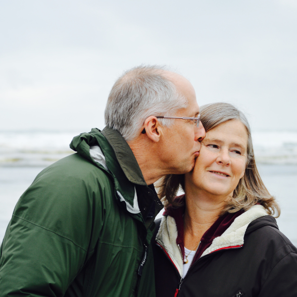 a man kissing a woman