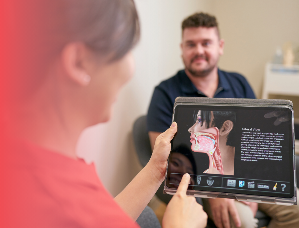speech pathologist with client during session